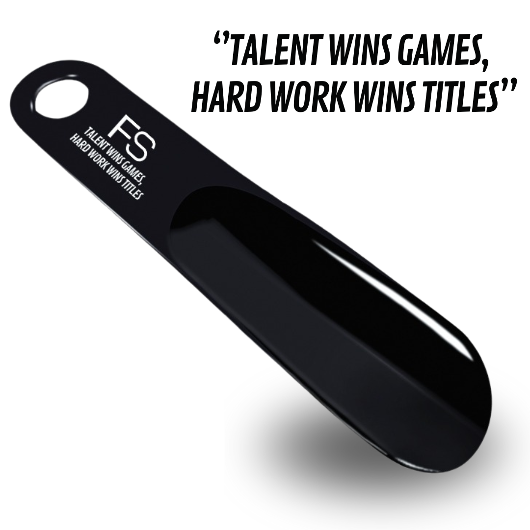 Bild vom scharzen FS Schuhanzieher mit schrift: FS Talent wins Games, Hart word wins titles